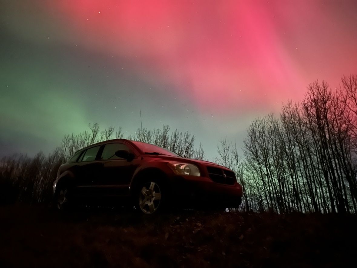 The Caliber under the red aurora