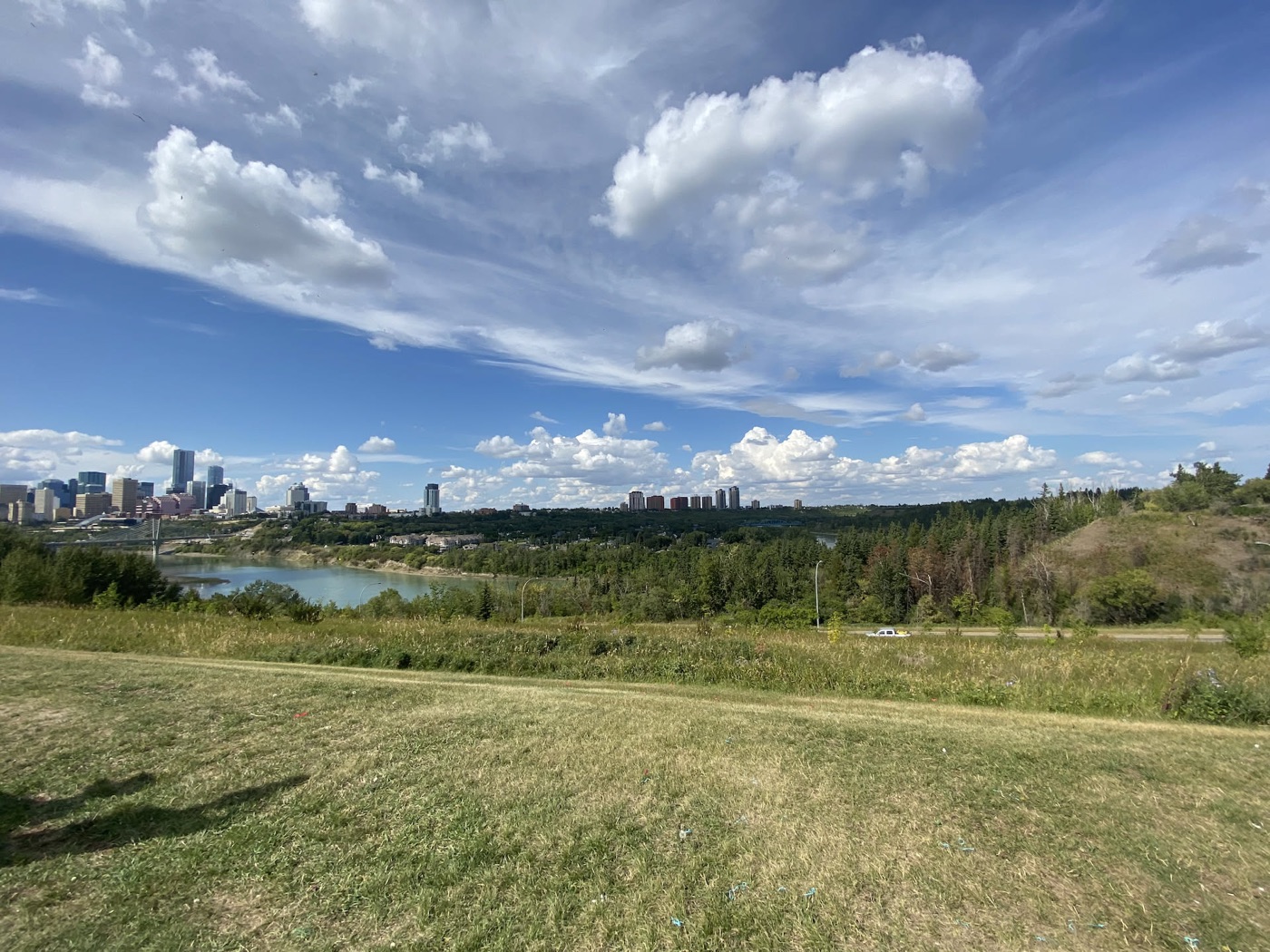 Edmonton's skyline over the North Saskatchewan river valley on a summer day
